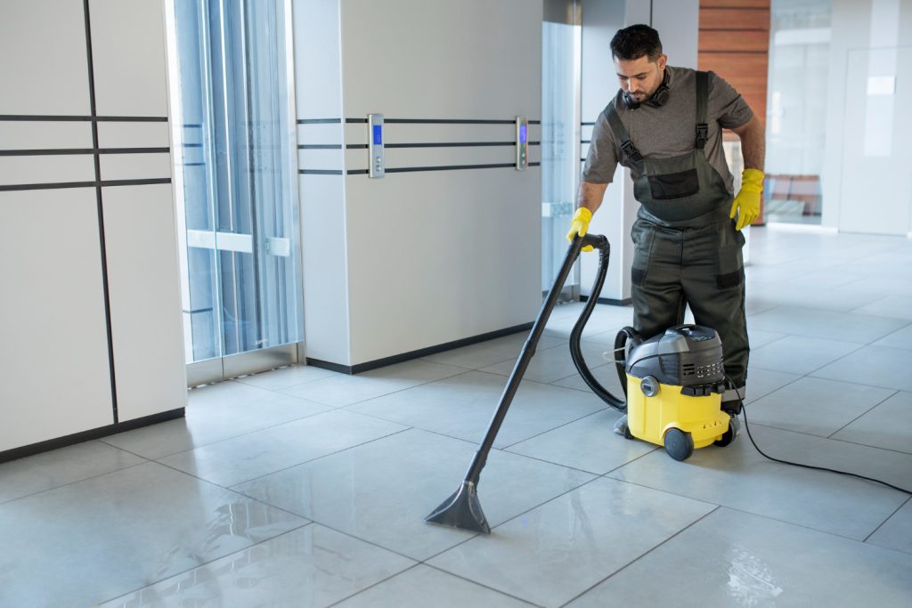 A Professional Cleaning cleaning the floor