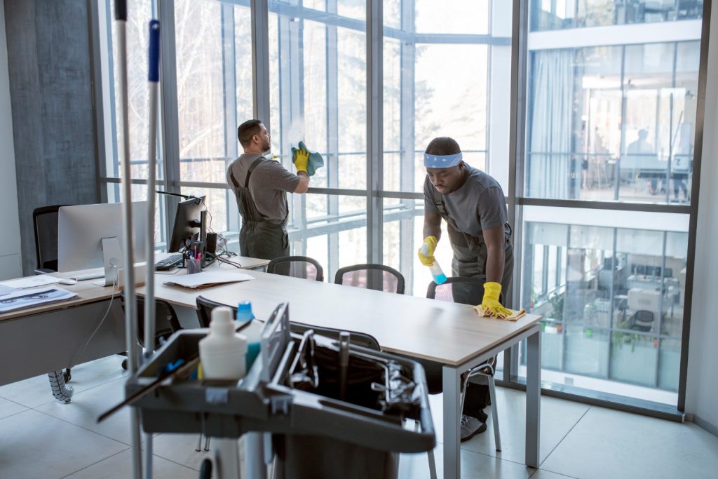 Professional Cleaners cleaning an office space